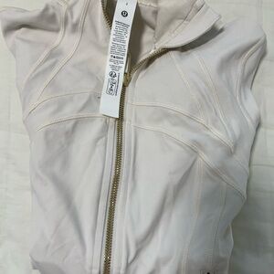 Lululemon Athletica define cropped jacket light ivory / gold hardware